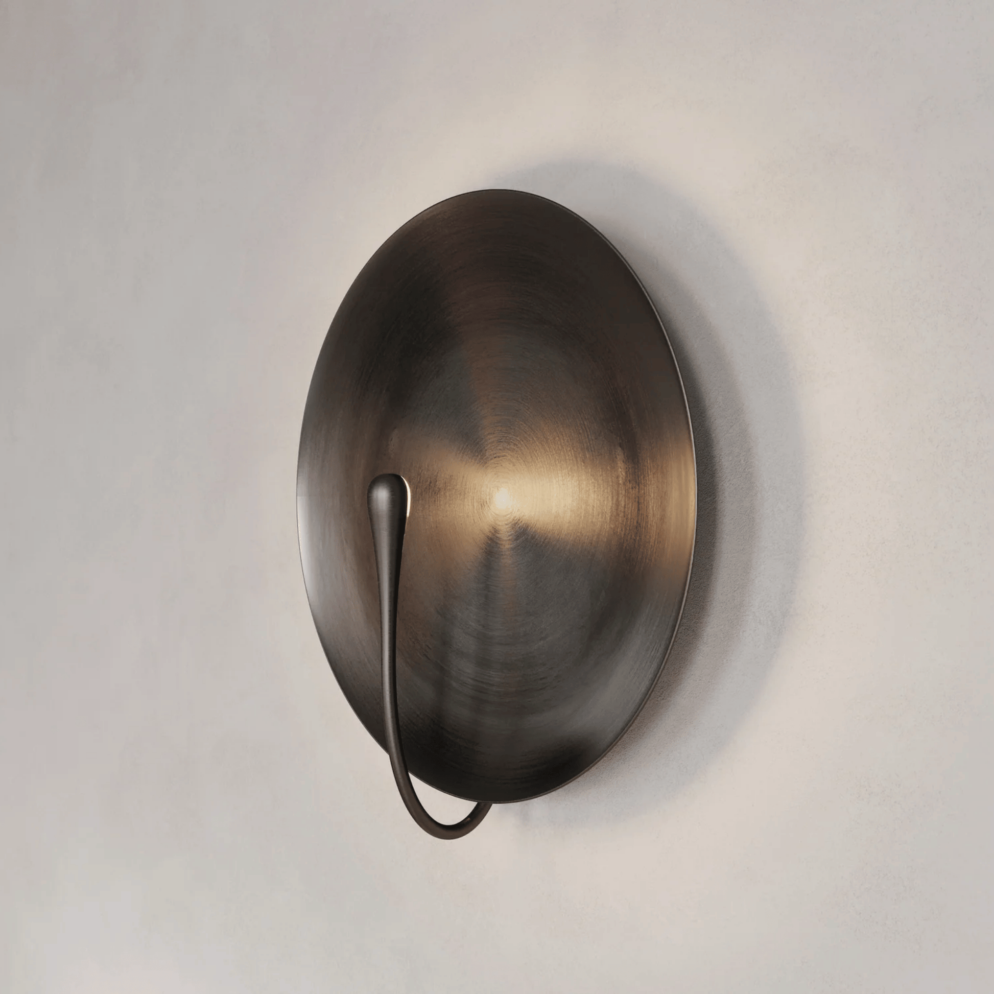 Bronze wall sconce on a light gray background