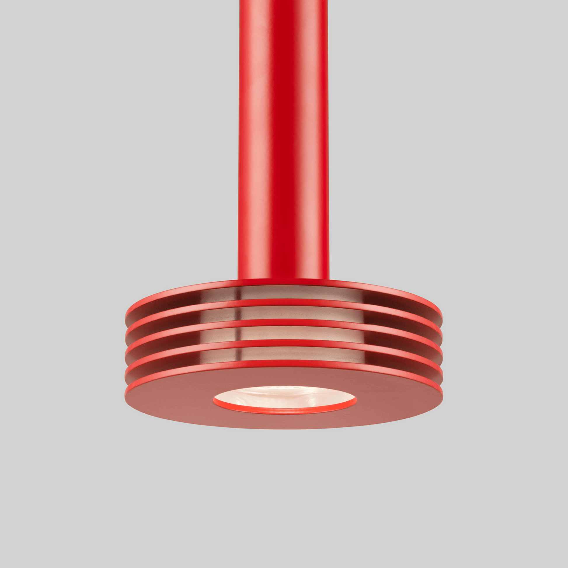 Red pendant light fixture on a gray background