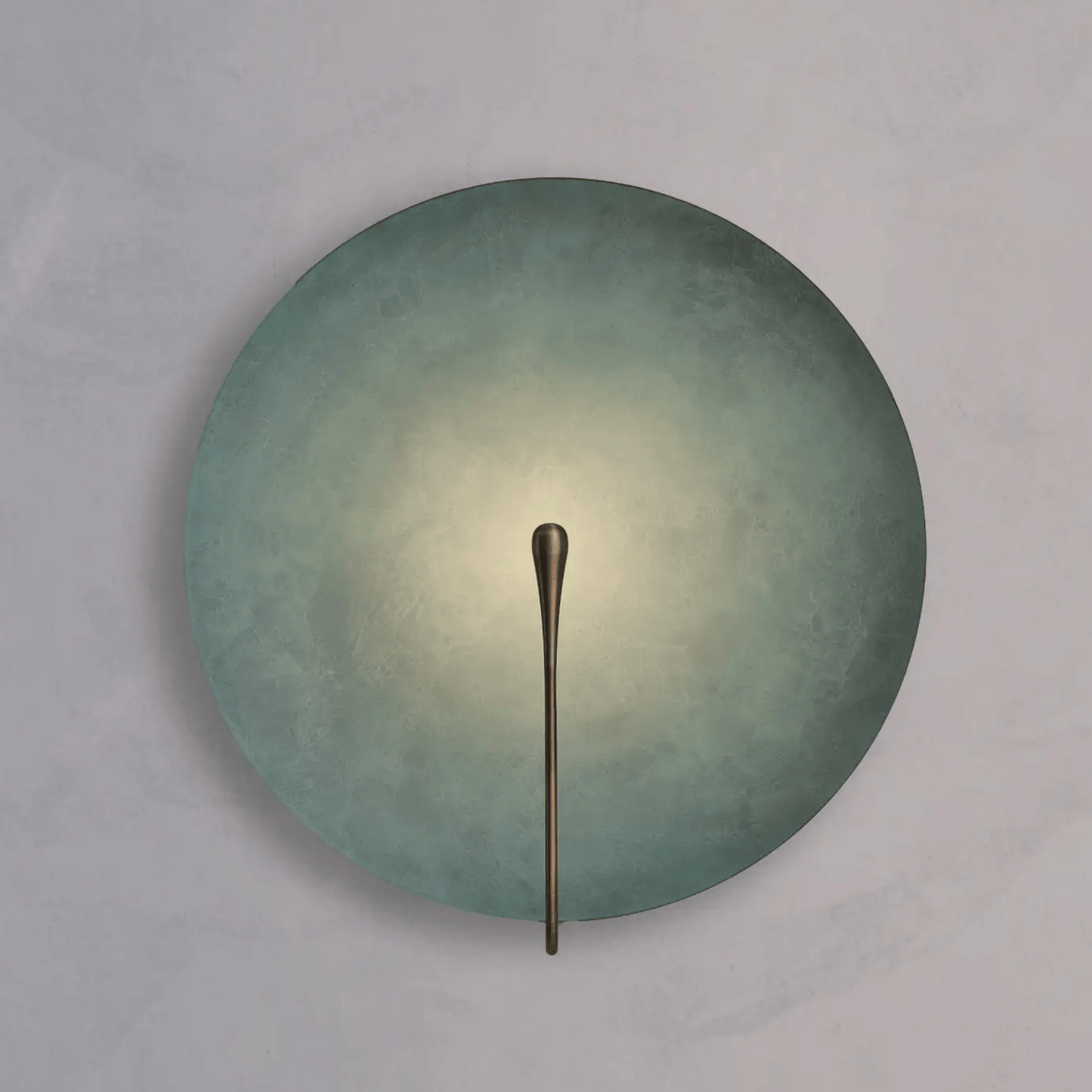 Round wall light fixture with a metallic arm on a gray background
