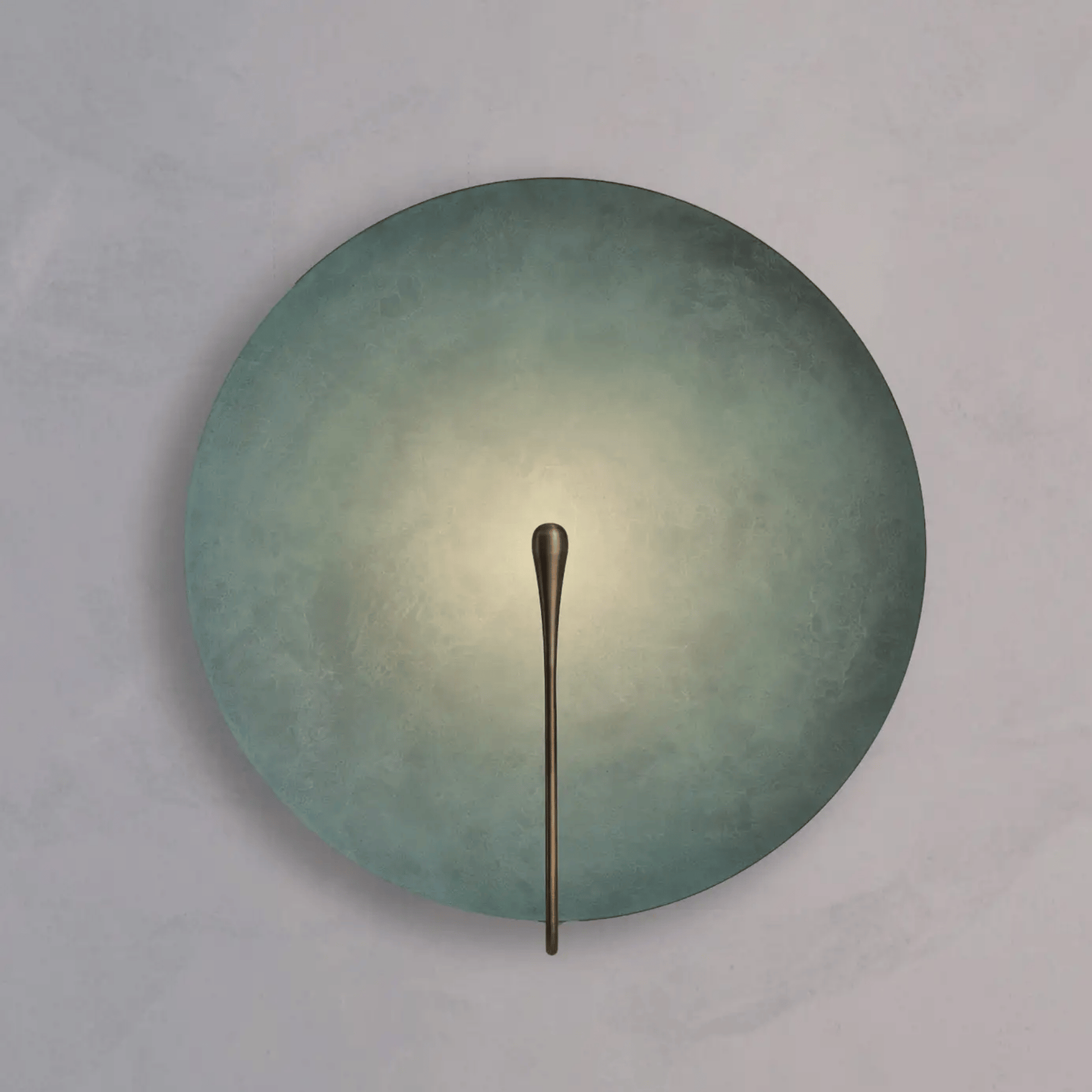 Round wall light fixture with a metallic arm on a gray background
