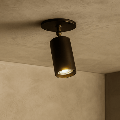 Ceiling light fixture on a textured ceiling and wall