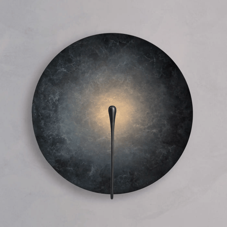 Wall-mounted light fixture with dark circular shade and thin black arm on a gray background