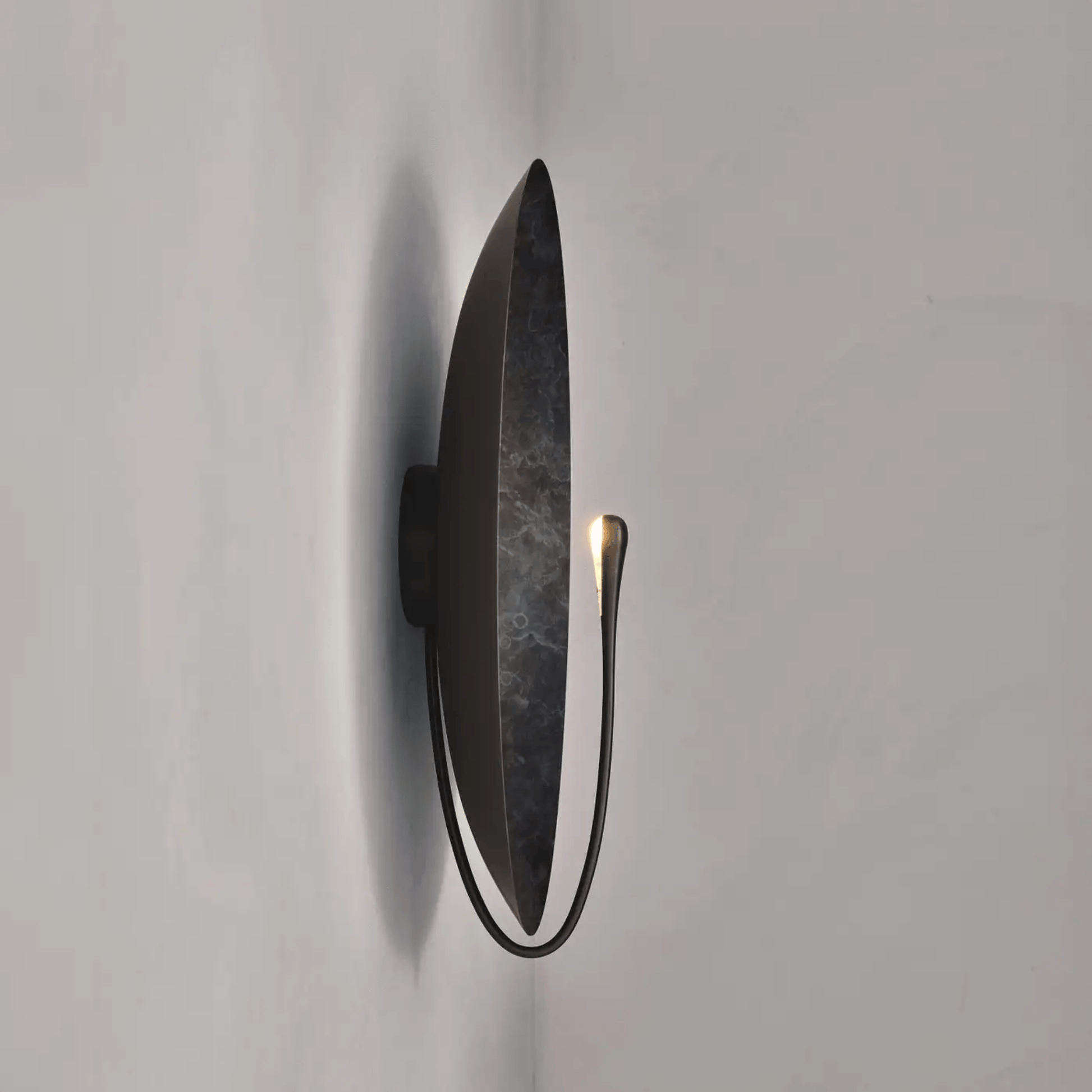 Modern wall light fixture on a plain white background