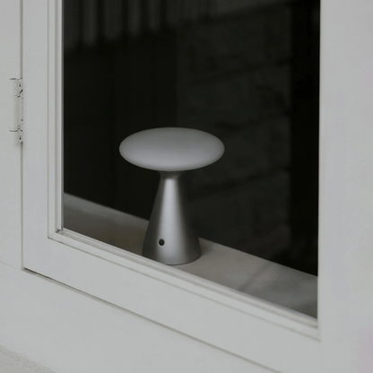Small white stool reflected in a window