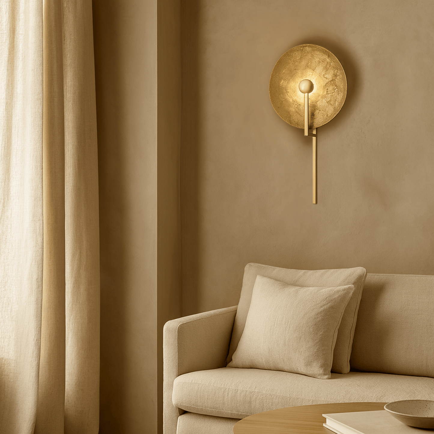 Beige wall lamp on a beige wall above a beige sofa with a beige curtain.