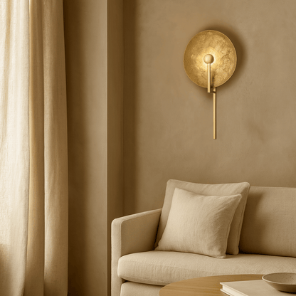 Beige wall lamp on a beige wall above a beige sofa with a beige curtain.