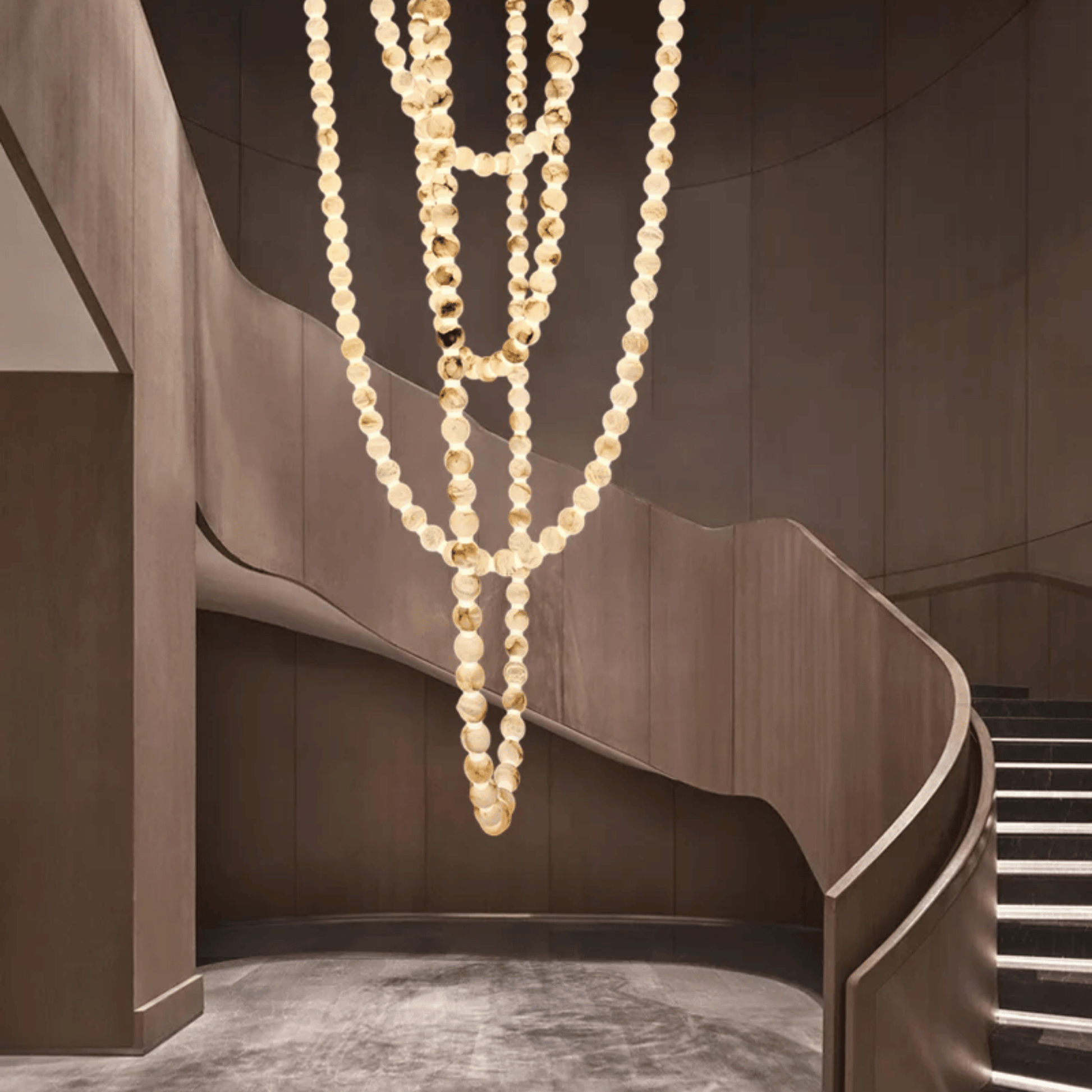 Pearl necklace hanging in a modern interior setting
