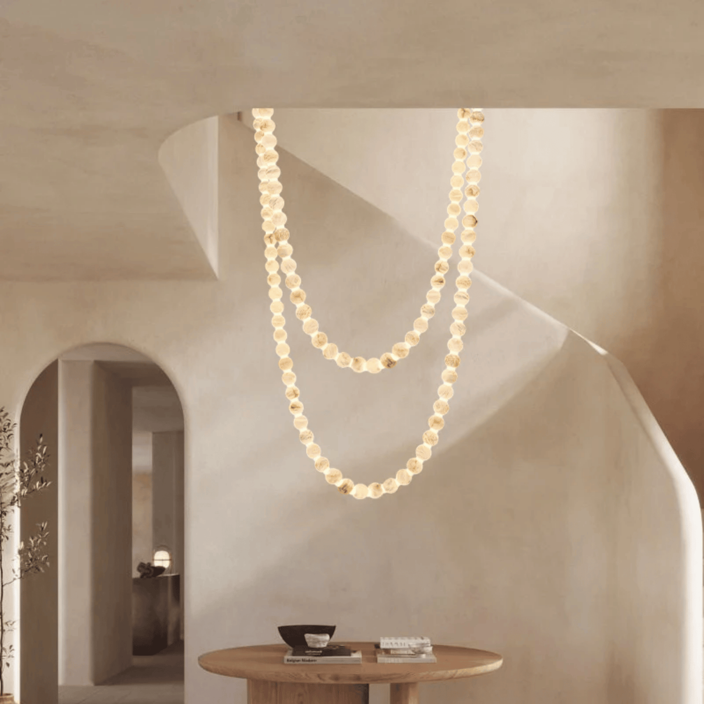 Pearl necklace hanging from a ceiling in a modern interior setting