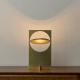 Modern table lamp with a geometric design on a wooden surface.