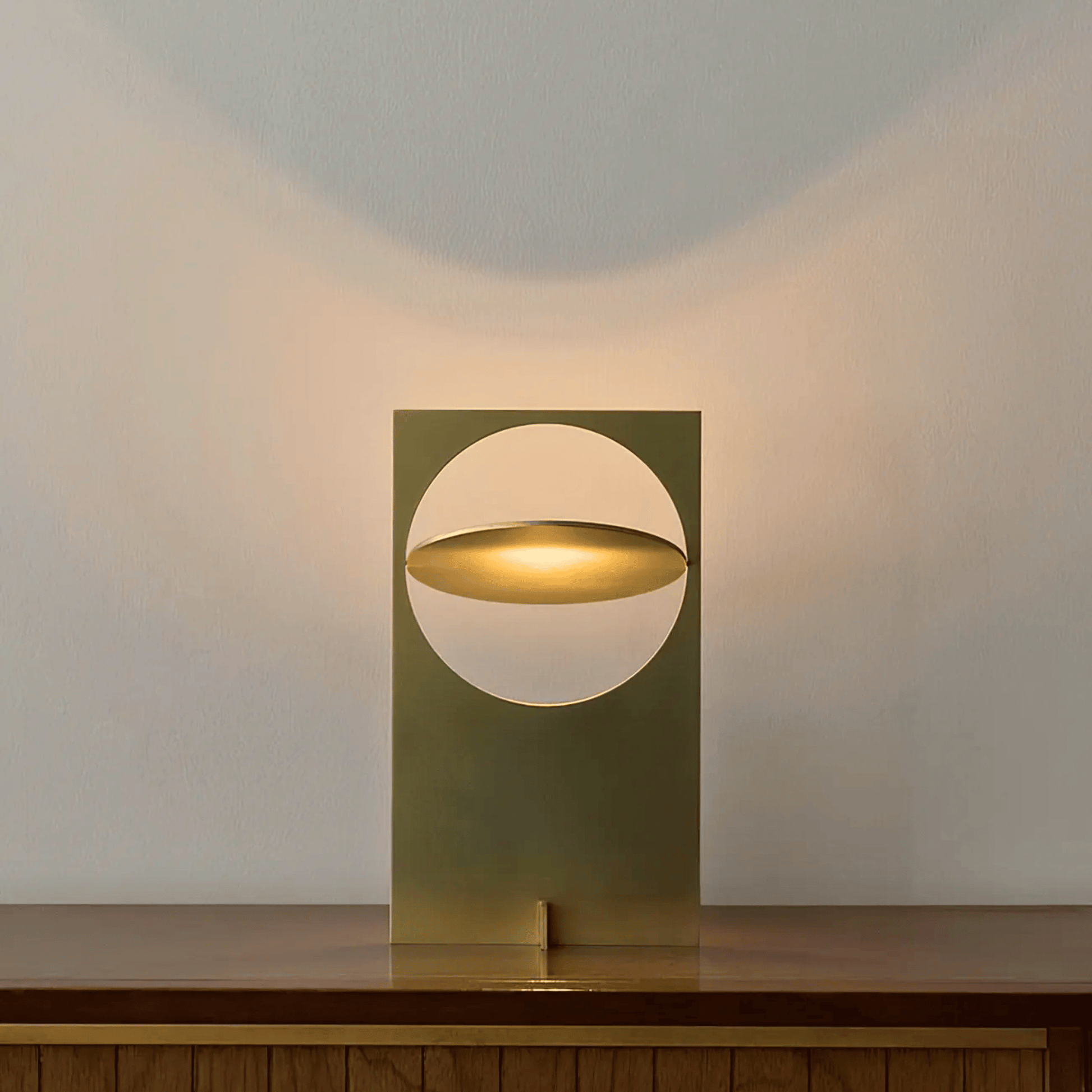 Modern table lamp with a geometric design on a wooden surface.