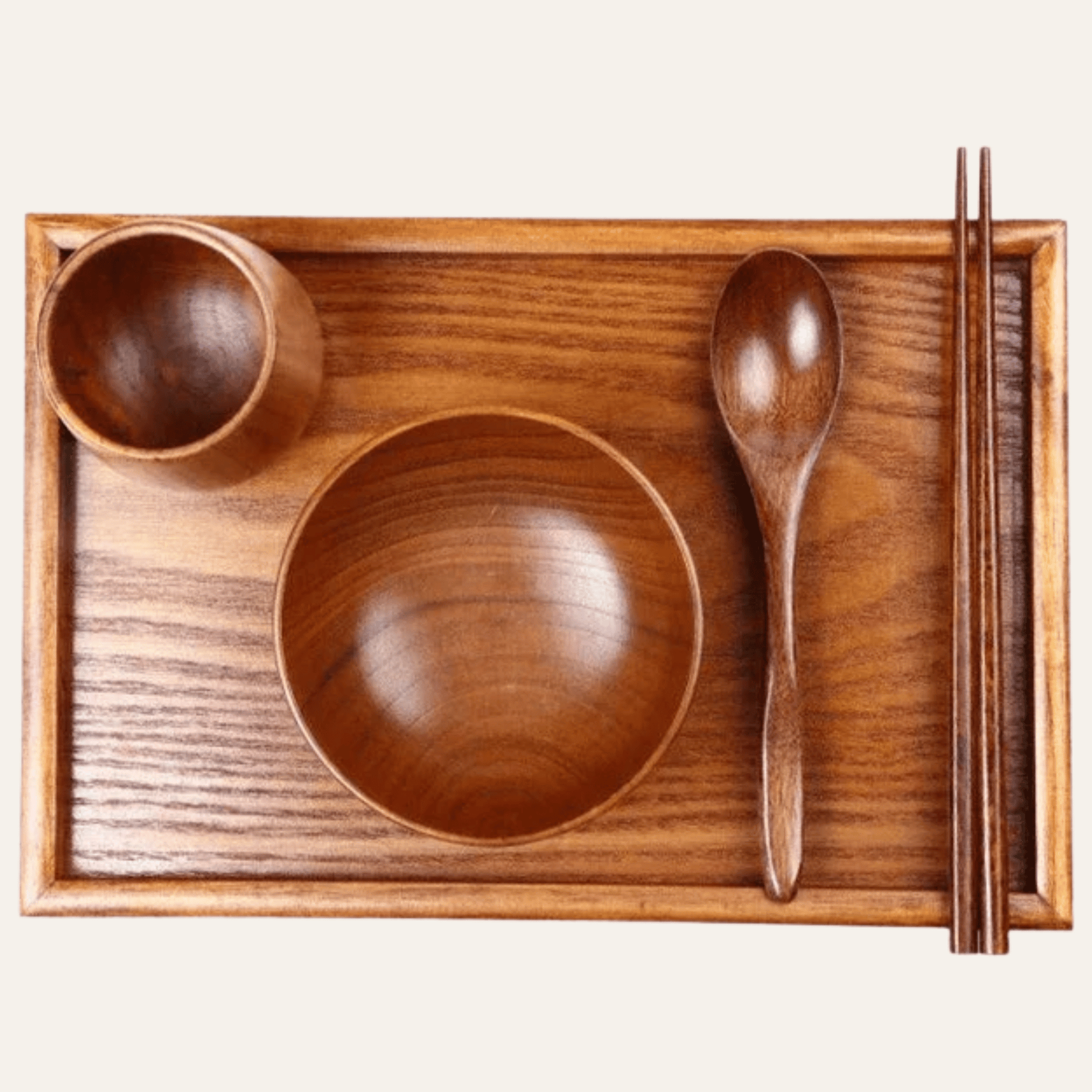 Wooden dining set with bowl, spoon, and chopsticks on a wooden tray.