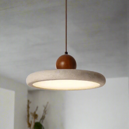Pendant light with concrete shade and wooden bulb holder on a gray background