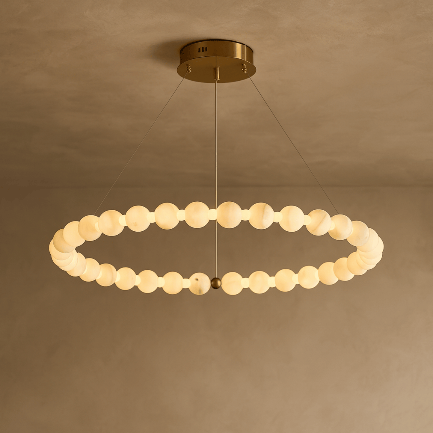 Modern chandelier with circular design on a beige background
