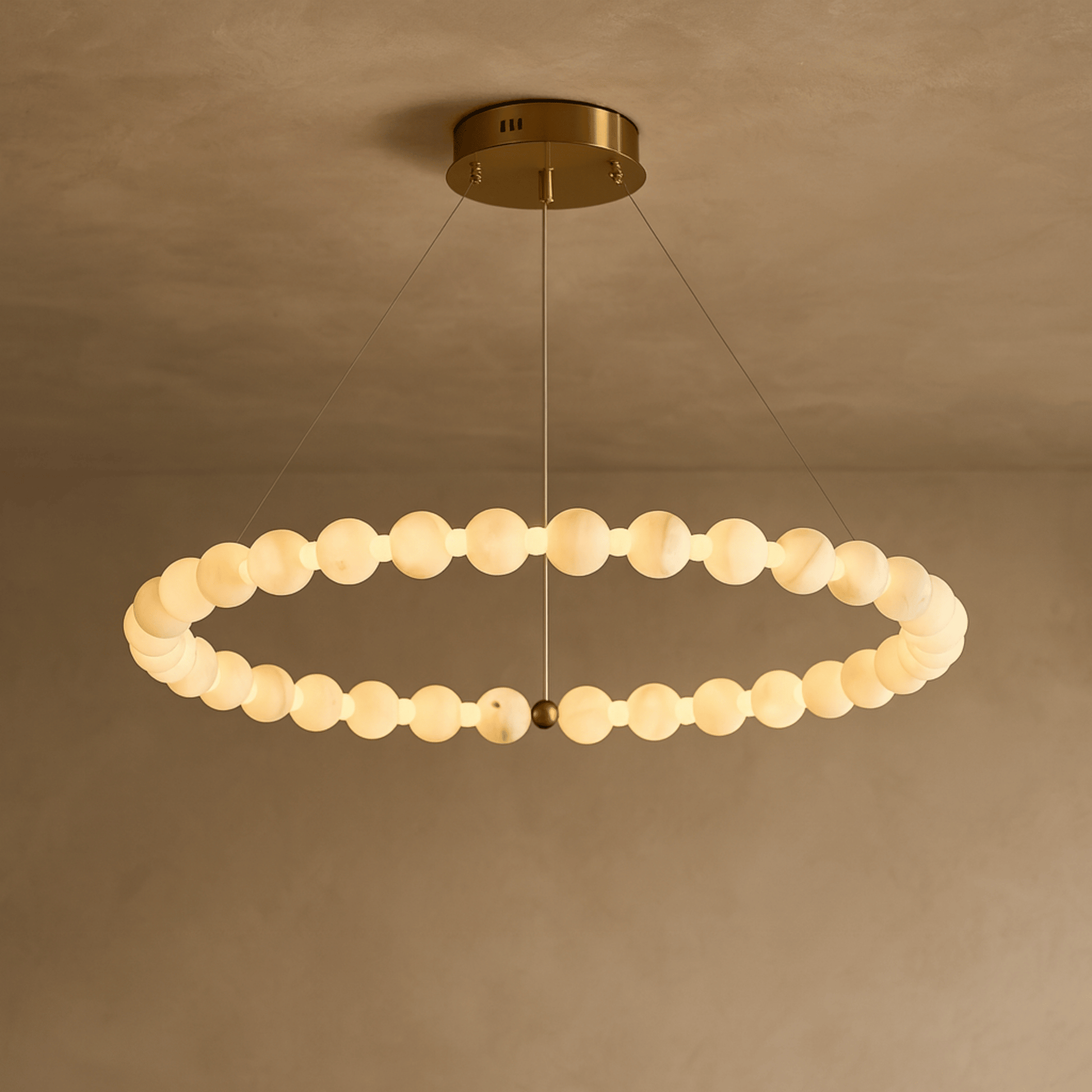 Modern chandelier with circular design on a beige background
