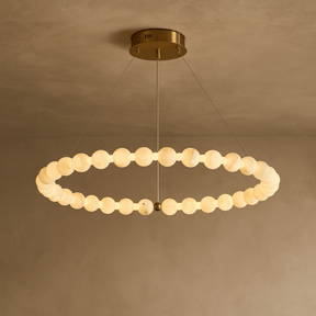 Modern chandelier with circular design on a beige background