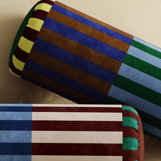 Colorful striped fabric swatches on a beige background