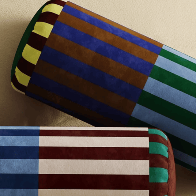 Colorful striped fabric swatches on a beige background