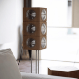 Wooden floor lamp with circular design in a room setting