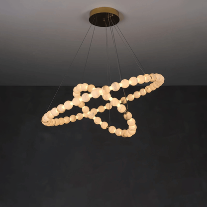 Modern chandelier with circular design on a dark background