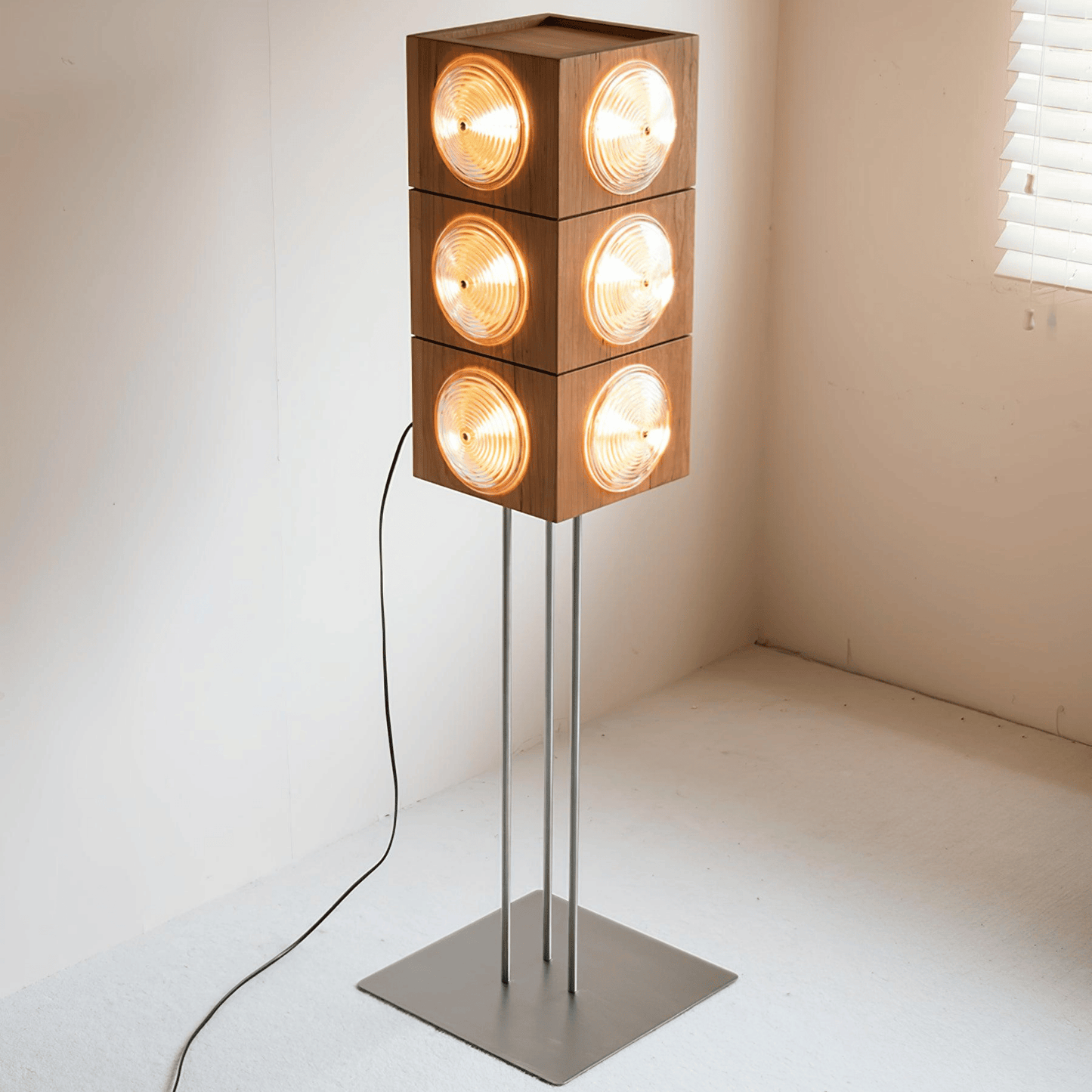 Modern floor lamp with square wooden light fixtures on a neutral background
