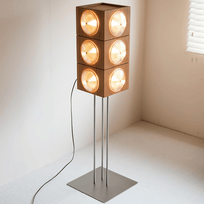 Modern floor lamp with square wooden light fixtures on a neutral background
