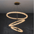 Modern chandelier with circular design on a dark background
