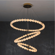 Modern chandelier with circular design on a dark background