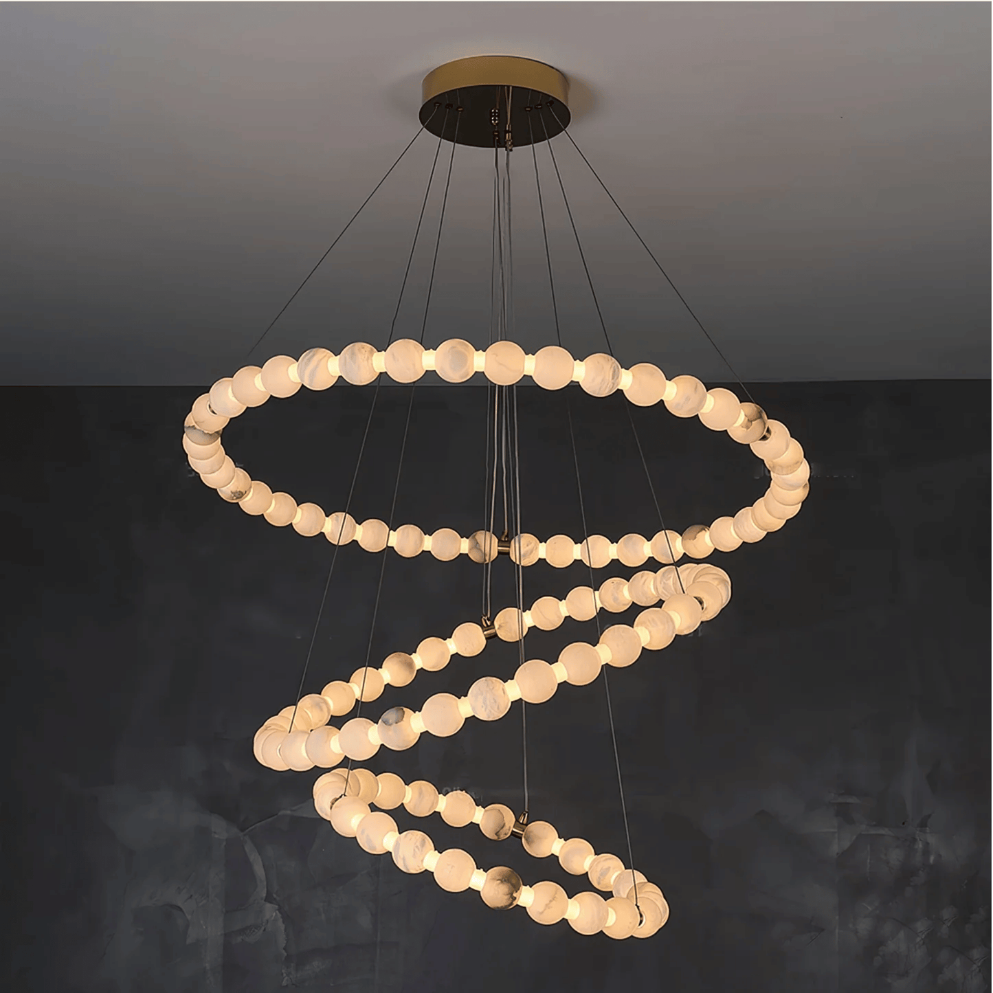 Modern chandelier with circular design on a dark background