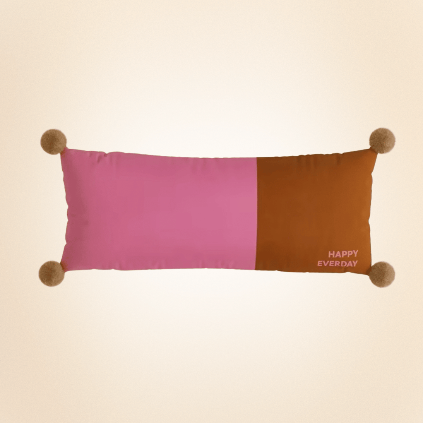 Color-blocked pillow with pink and brown sections and 'Happy Every Day' text on a beige background
