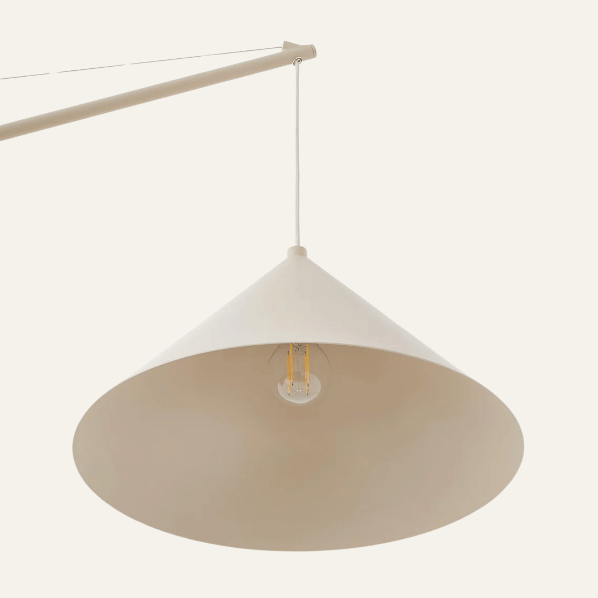 Beige pendant lamp with a white shade on a white background