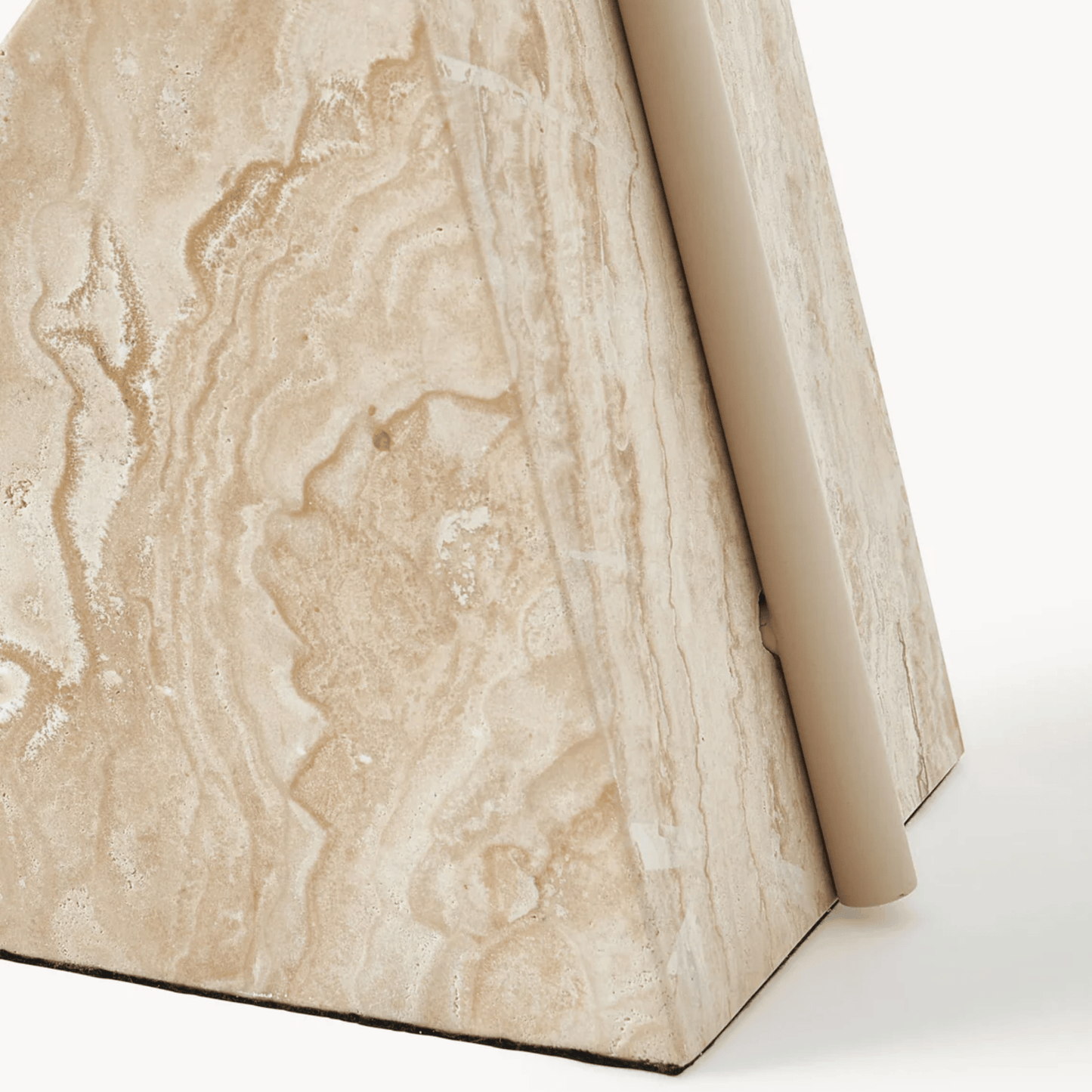 Close-up of a beige marble surface with a white background