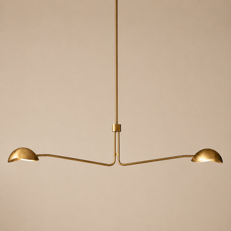 Gold pendant light fixture on a beige background