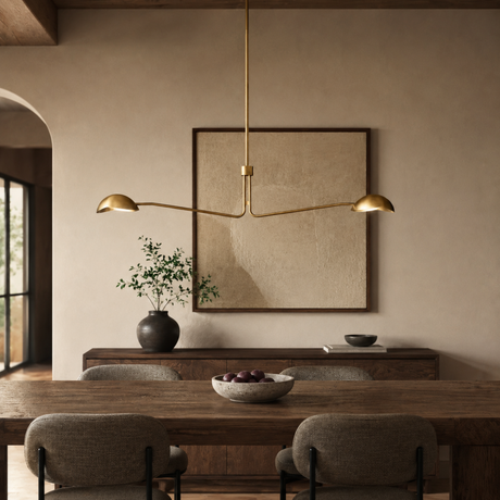 Modern dining room with a long wooden table, chairs, and a pendant light fixture.