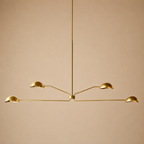Gold pendant light fixture on a beige background