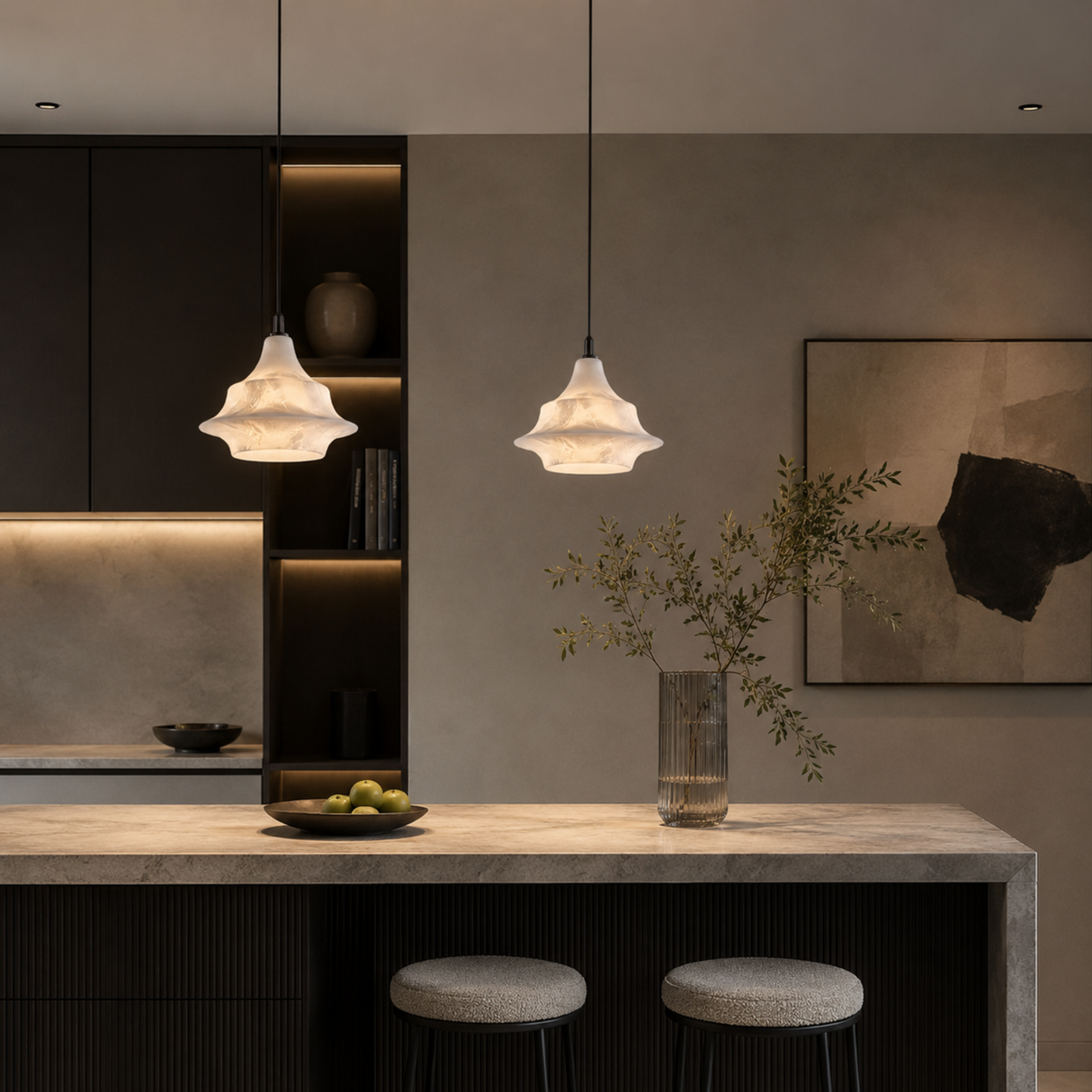 Modern kitchen with pendant lights, a vase with plants, and bar stools.
