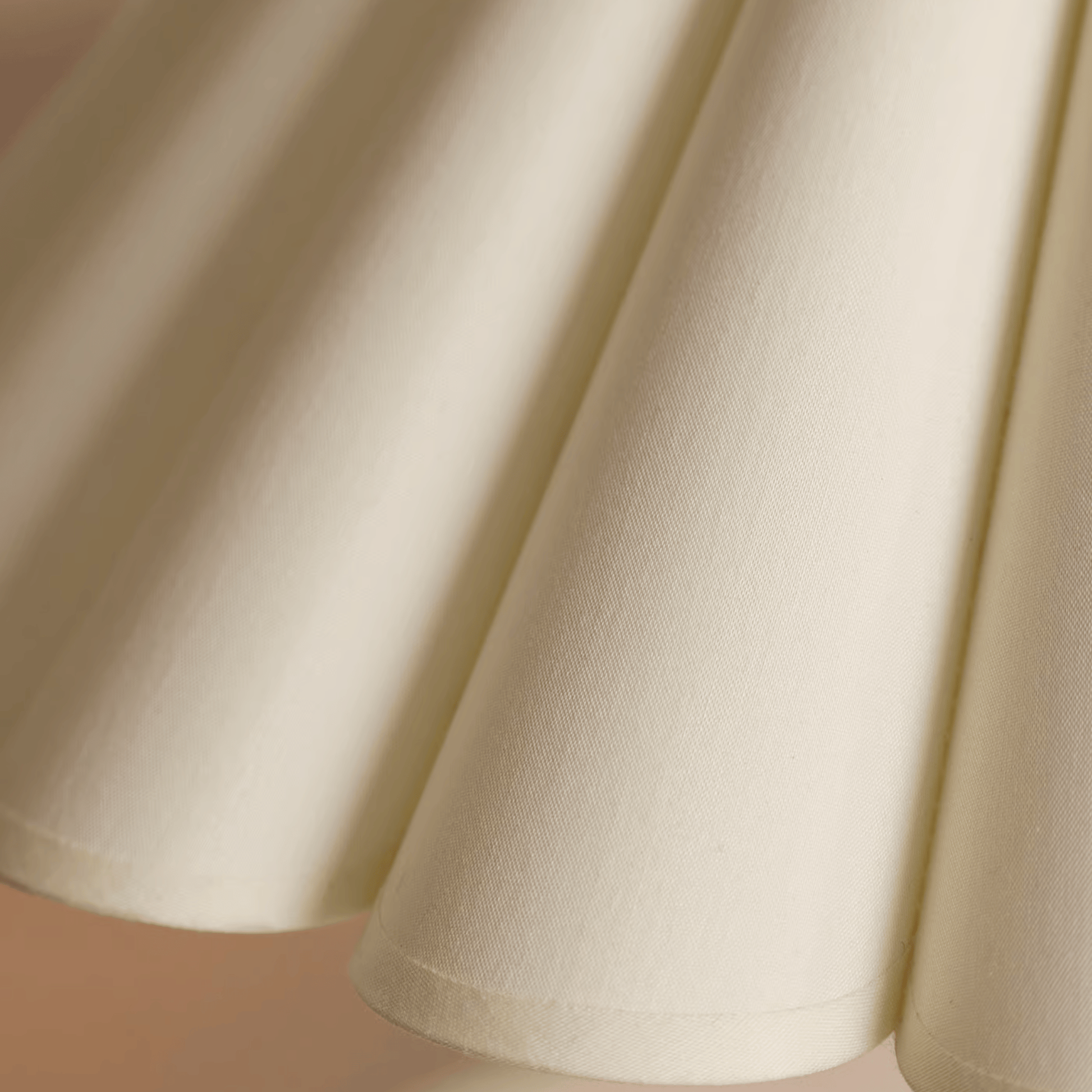 Close-up of beige fabric with a soft texture