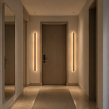 Modern hallway with a door and wall lights