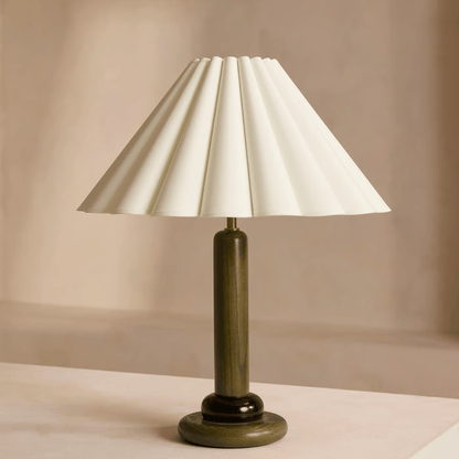 Table lamp with a white shade on a beige background