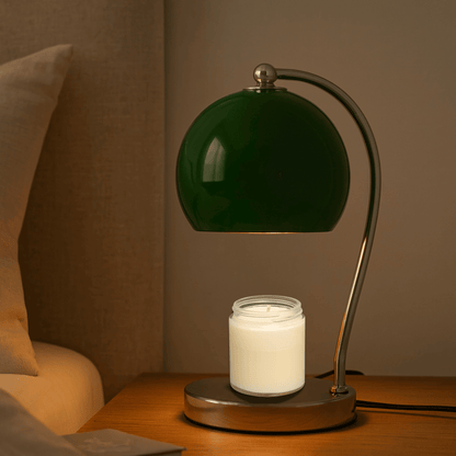 Table lamp with white shade and metal base on a wooden surface.