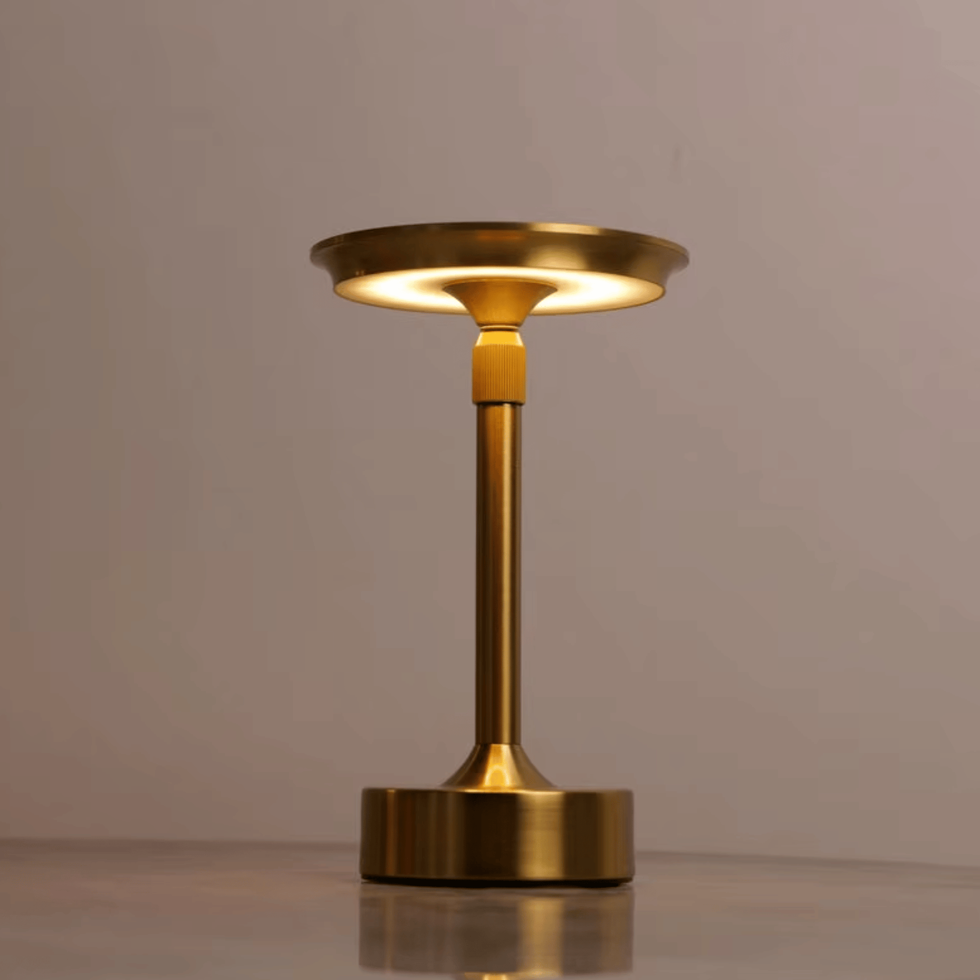 Gold table lamp on a neutral background
