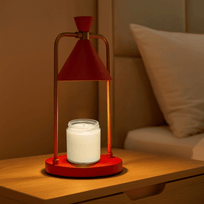 Modern table lamp with red cone-shaped shade and gold accents on a beige background