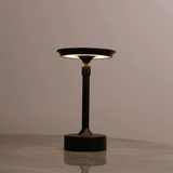 Modern black table lamp on a neutral background