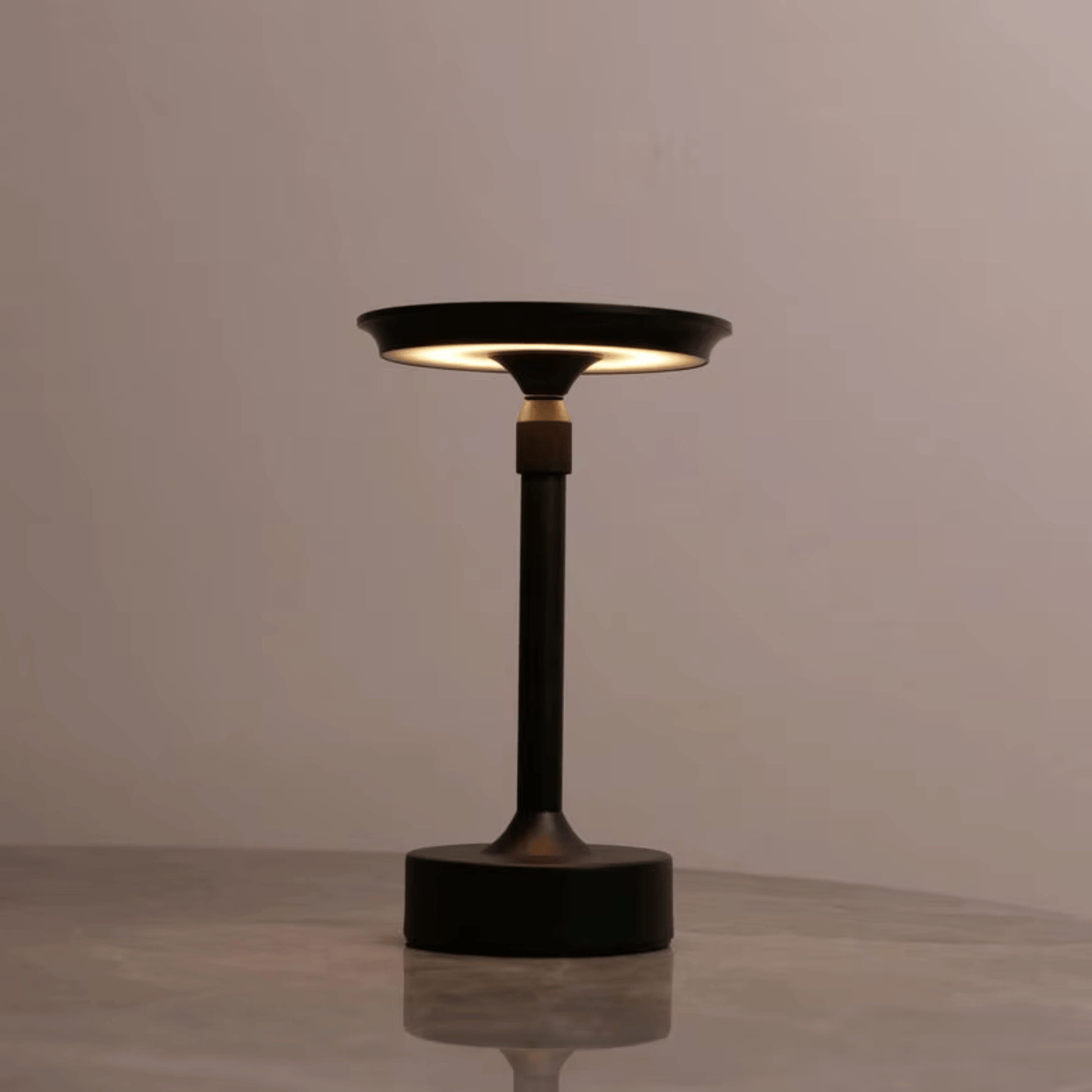 Modern black table lamp on a neutral background