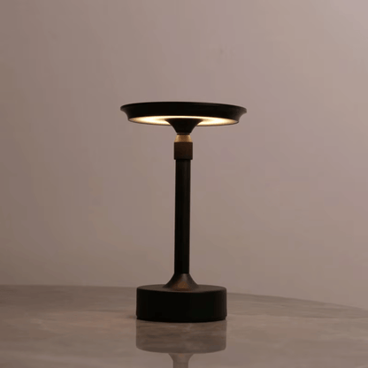 Modern black table lamp on a neutral background
