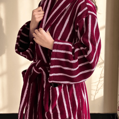 Maroon and white striped robe being worn by a person.
