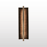 Decorative wall sconce with a textured design on a white background
