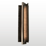 Modern wall-mounted light fixture with a textured design on a white background