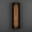 Rectangular wall sconce with a textured finish on a dark background