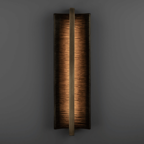 Rectangular wall sconce with a textured finish on a dark background