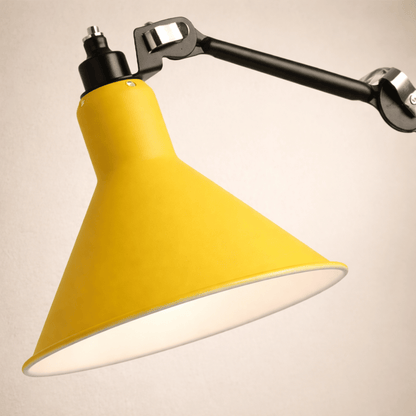 Yellow lampshade with a black adjustable arm on a beige background